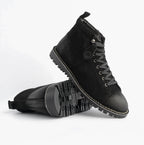 Popps 1961 MOD Mens Suede Monkey Boots in Black, pair with one boot tilted to show the sole edge